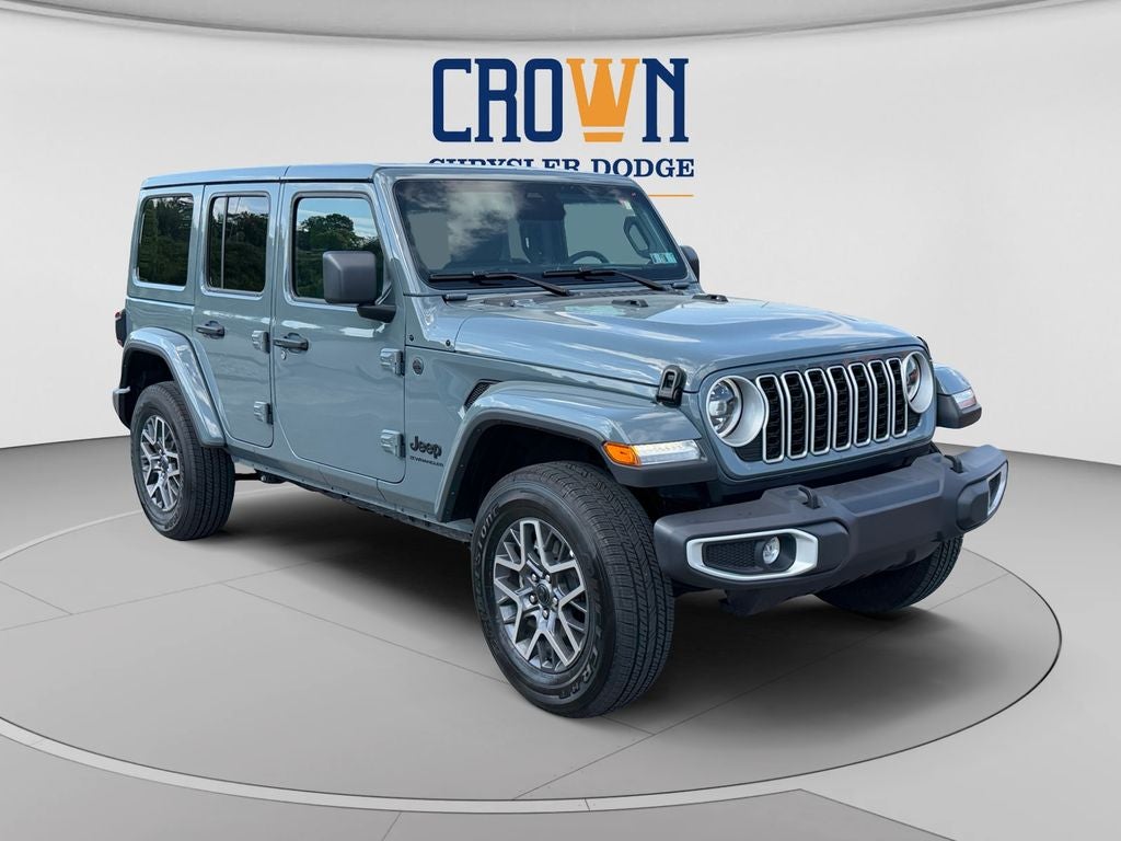 2026 Jeep Wrangler Sahara in Anvil Clear Coat — front three-quarter view