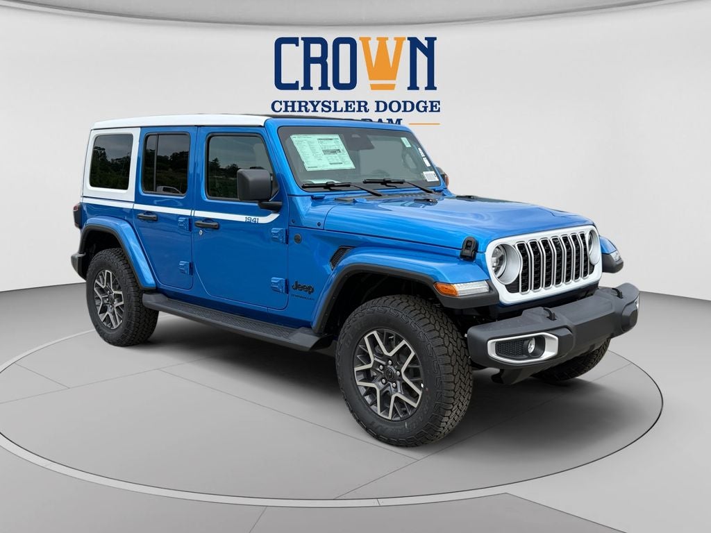 2026 Jeep Wrangler Sahara in Hydro Blue Pearl Coat — front three-quarter view