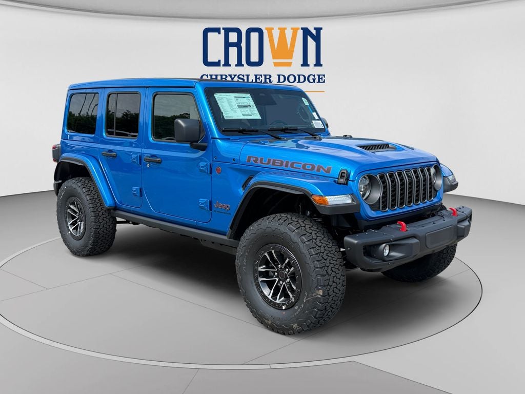 2026 Jeep Wrangler Rubicon X in Hydro Blue Pearl Coat — front three-quarter view