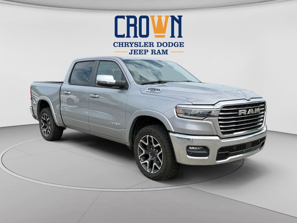 2025 RAM 1500 Laramie in Billet Silver Metallic Clearcoat — front three-quarter view