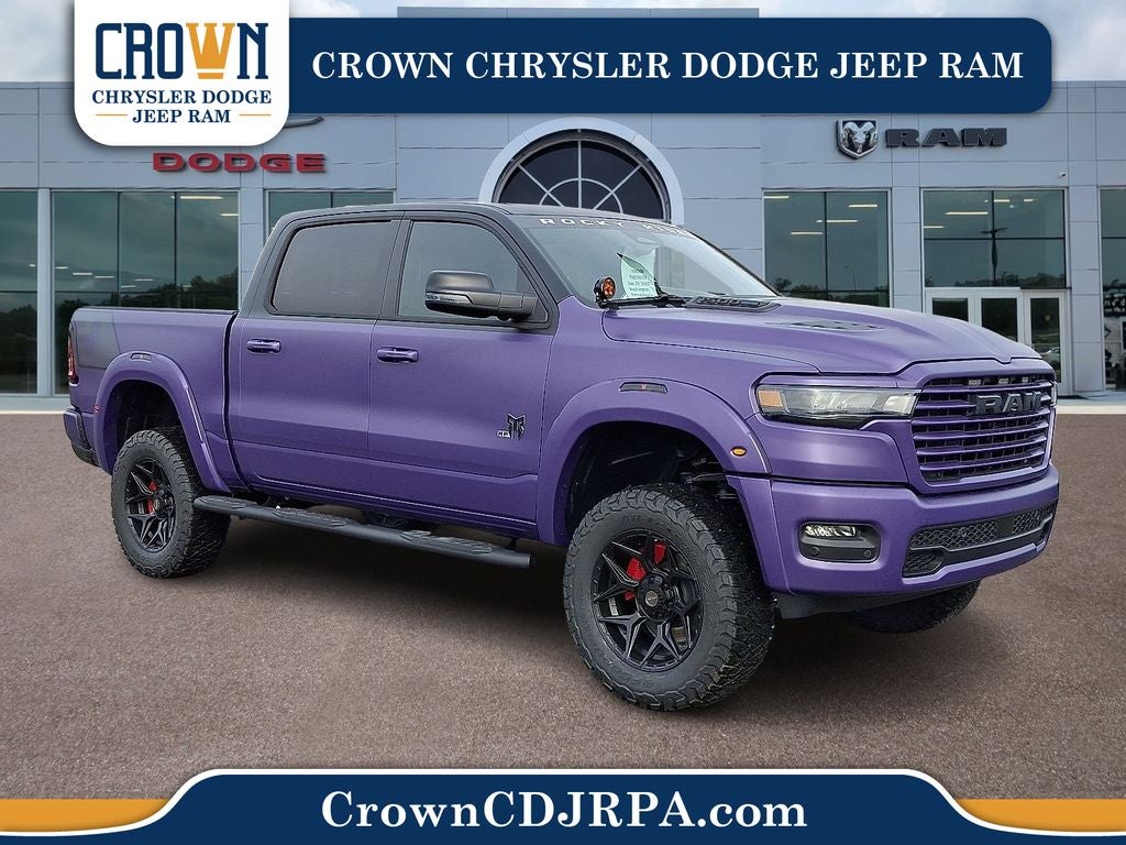 2026 RAM 1500 Laramie in Diamond Black Crystal Pearlcoat — front three-quarter view