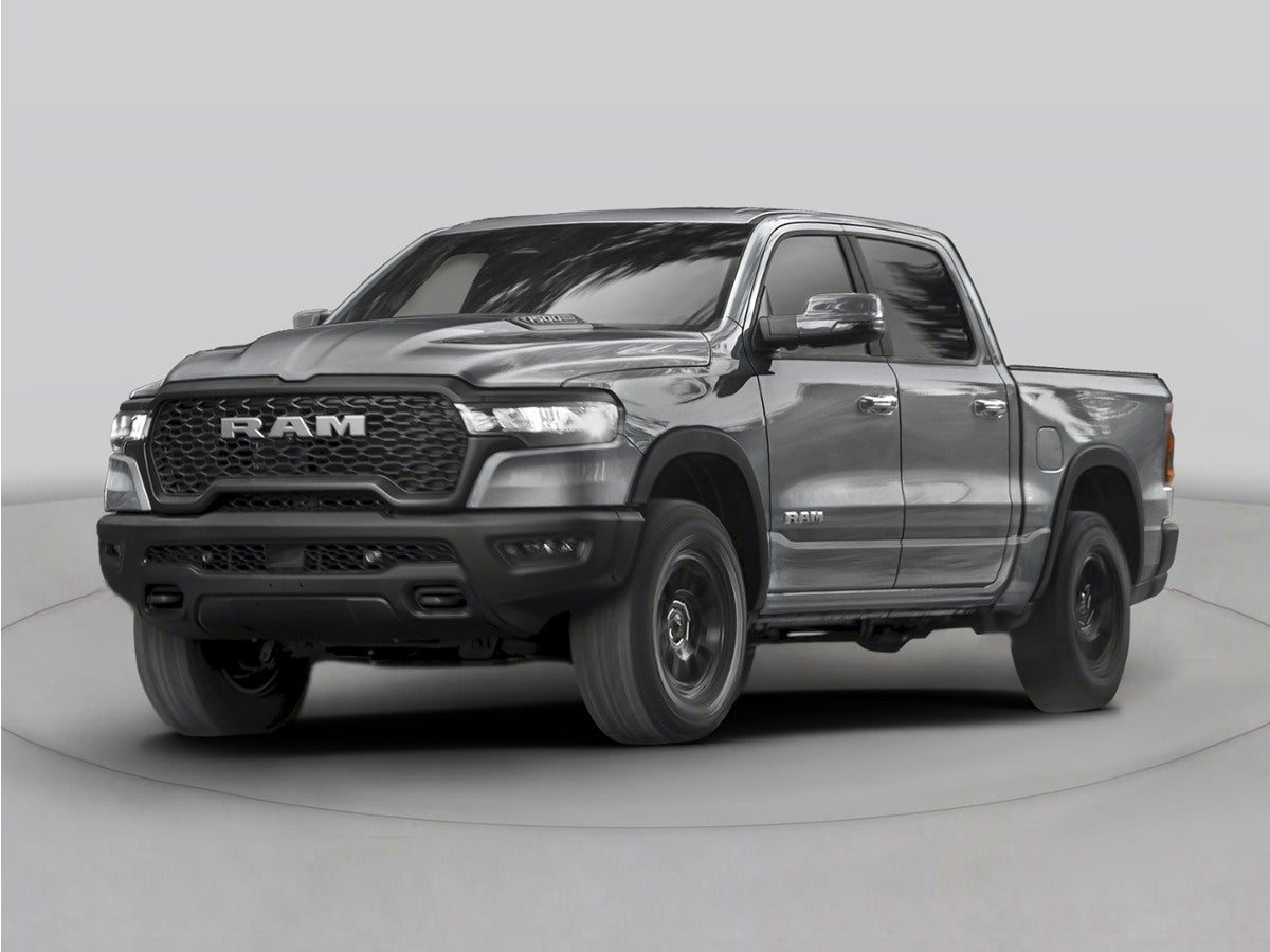 2026 RAM 1500 Laramie in Molten Red Pearlcoat — front three-quarter view