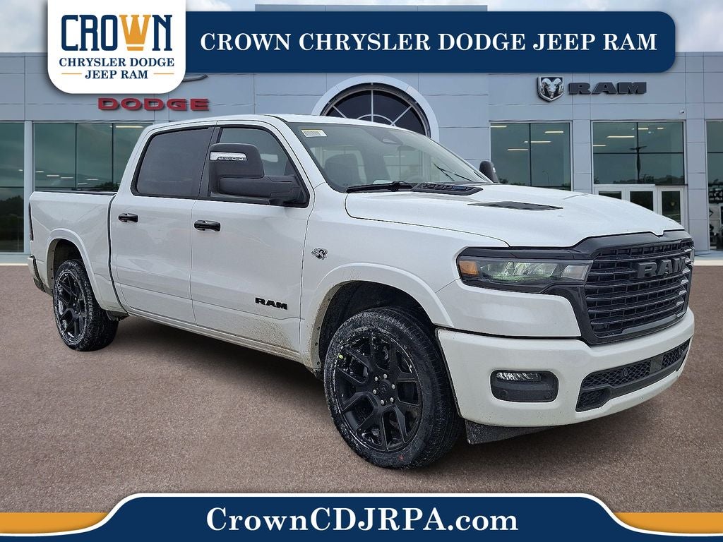 2026 RAM 1500 Laramie in Ivory White Tri-Coat Pearlcoat — front three-quarter view