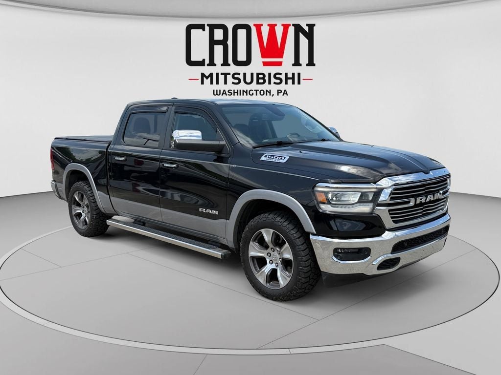 2019 RAM 1500 Laramie in Diamond Black Crystal Pearlcoat — front three-quarter view
