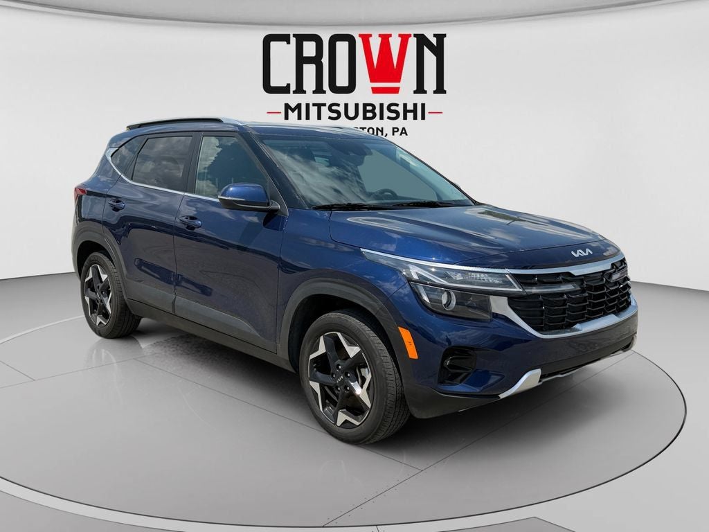 2025 Kia Seltos EX in Dark Ocean Blue — front three-quarter view